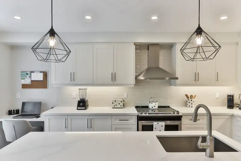 Kitchen with black pendant lights