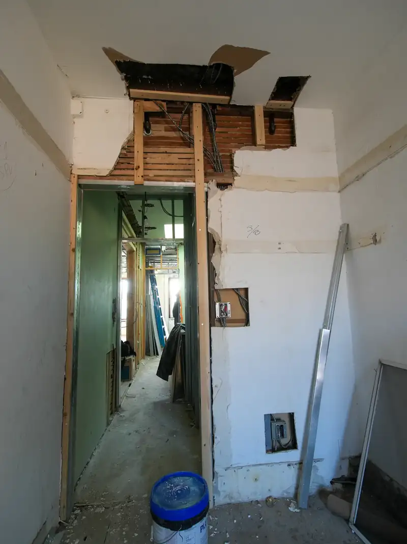 Interior room under renovation with exposed framing