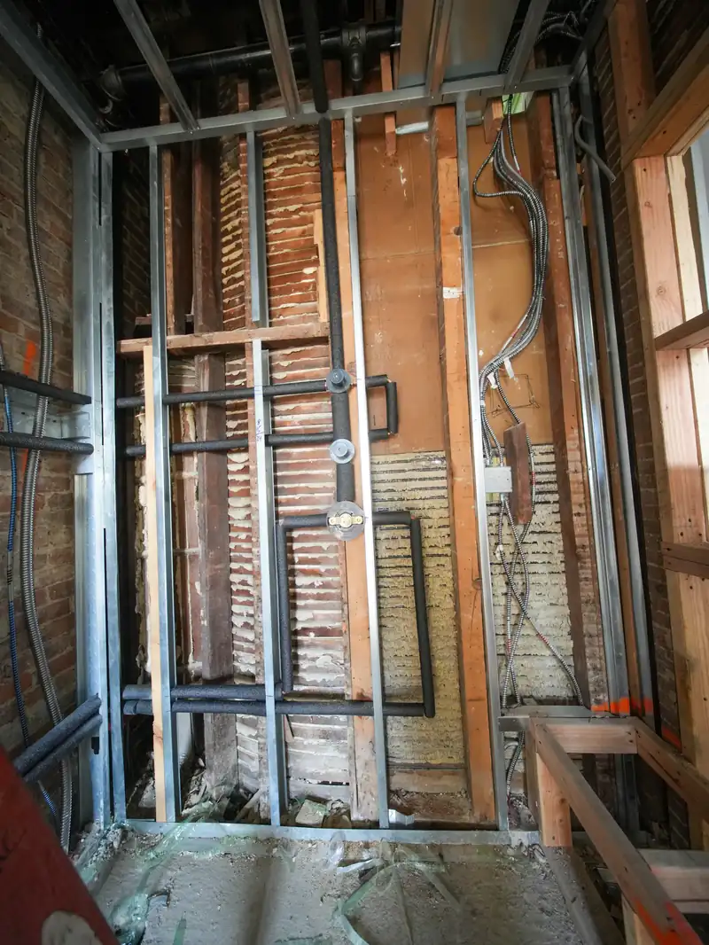 Interior under construction with exposed wiring